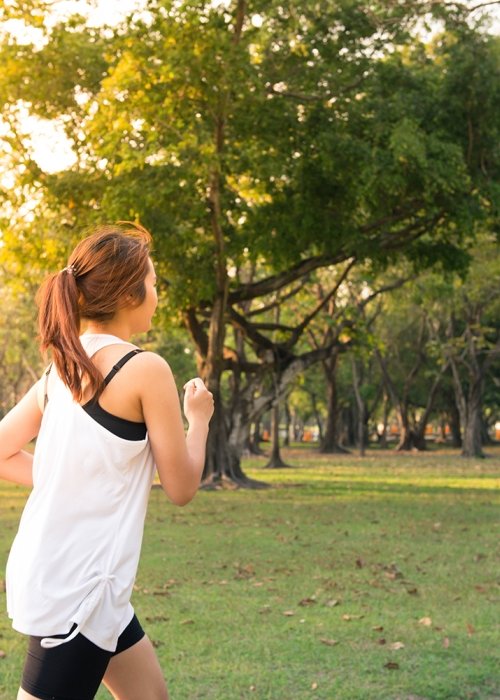 Canva - Young Woman Running in Wood, Training and Exercising for Trail R (1).jpg