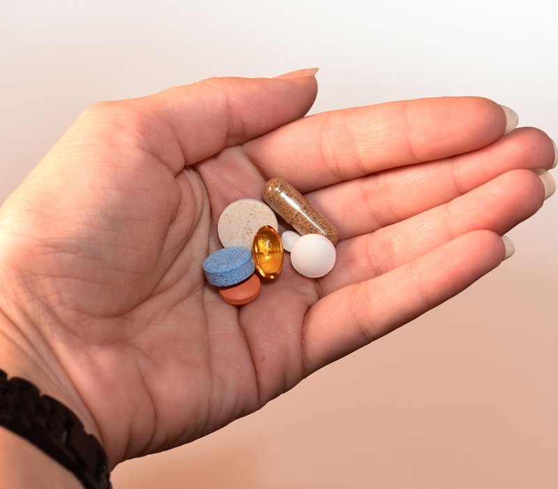 Canva - Person Holding Medication Pill and Capsules.jpg